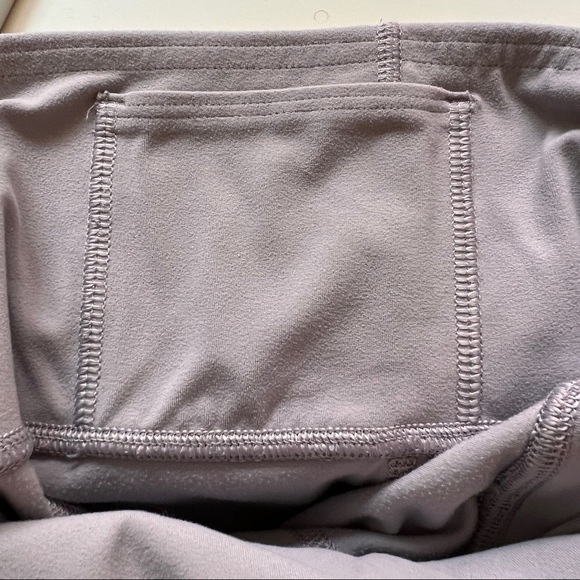 ATHLETA Leggings. Gray. Inside key pocket, 2 hip pockets. Seamed details. XS - Picture 7 of 8